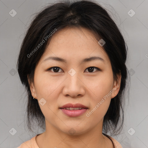 Joyful asian young-adult female with medium  brown hair and brown eyes