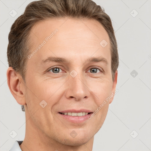 Joyful white adult male with short  brown hair and grey eyes