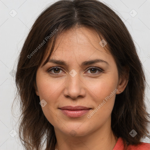 Joyful white adult female with medium  brown hair and brown eyes