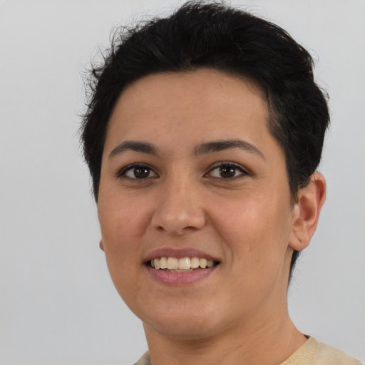 Joyful white young-adult female with short  black hair and brown eyes