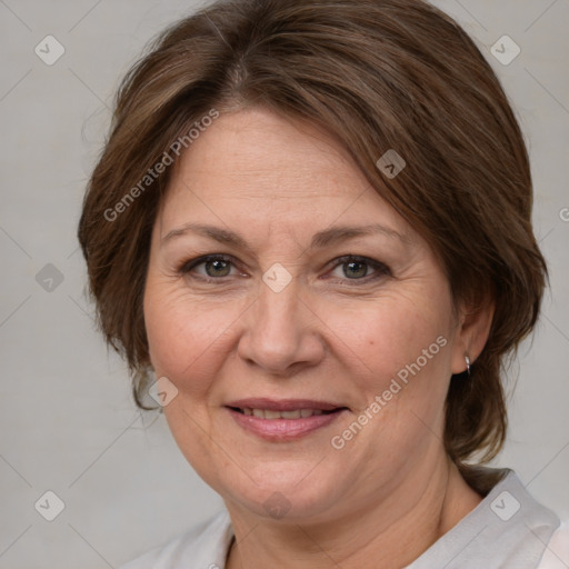 Joyful white adult female with medium  brown hair and brown eyes