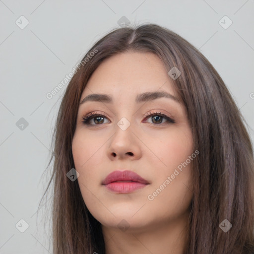 Neutral white young-adult female with long  brown hair and brown eyes