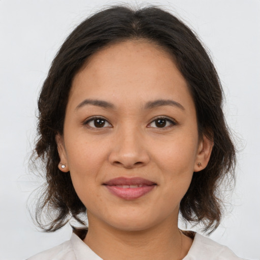 Joyful asian young-adult female with medium  brown hair and brown eyes