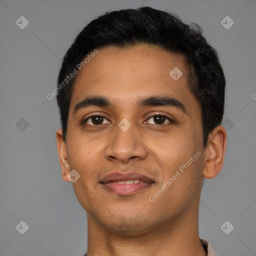 Joyful latino young-adult male with short  black hair and brown eyes