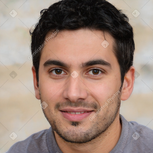 Joyful white young-adult male with short  black hair and brown eyes