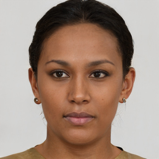 Neutral black young-adult female with short  brown hair and brown eyes