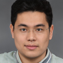 Neutral asian young-adult male with short  brown hair and brown eyes