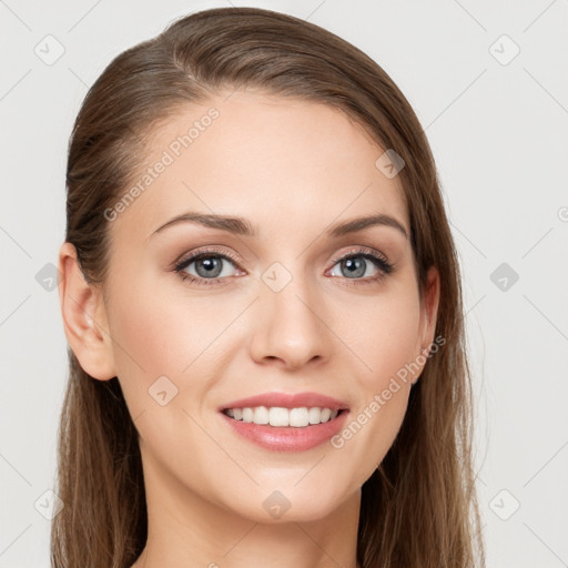 Joyful white young-adult female with long  brown hair and blue eyes