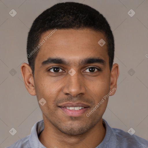 Joyful black young-adult male with short  black hair and brown eyes