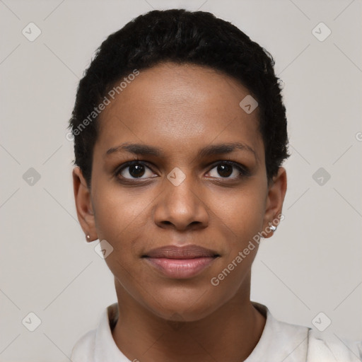 Joyful black young-adult female with short  black hair and brown eyes