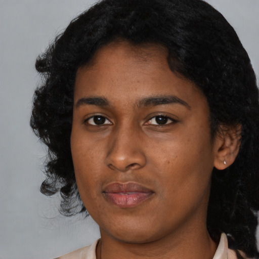 Neutral black young-adult female with long  black hair and brown eyes