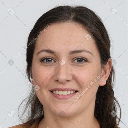 Joyful white young-adult female with long  brown hair and grey eyes