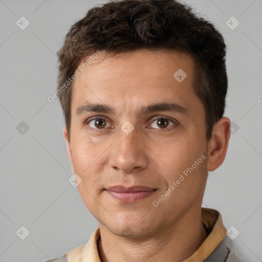 Joyful white adult male with short  brown hair and brown eyes