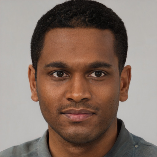 Neutral black young-adult male with short  brown hair and brown eyes