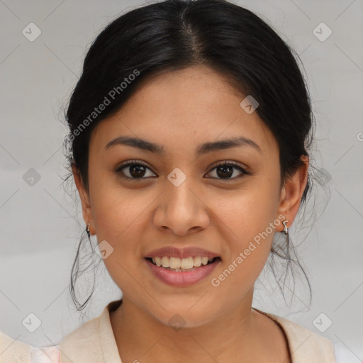 Joyful latino young-adult female with medium  brown hair and brown eyes