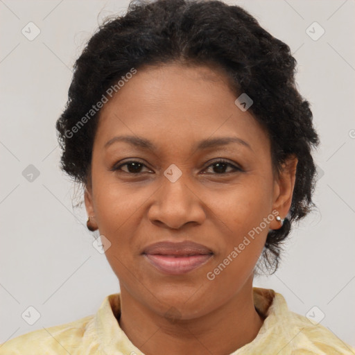 Joyful black adult female with short  brown hair and brown eyes