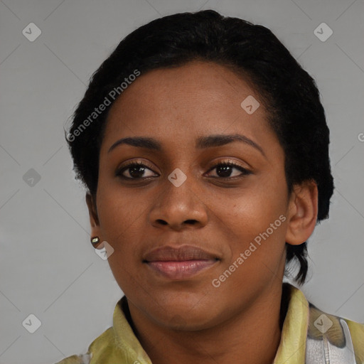 Joyful black young-adult female with medium  black hair and brown eyes