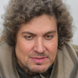 Joyful white adult male with medium  brown hair and brown eyes