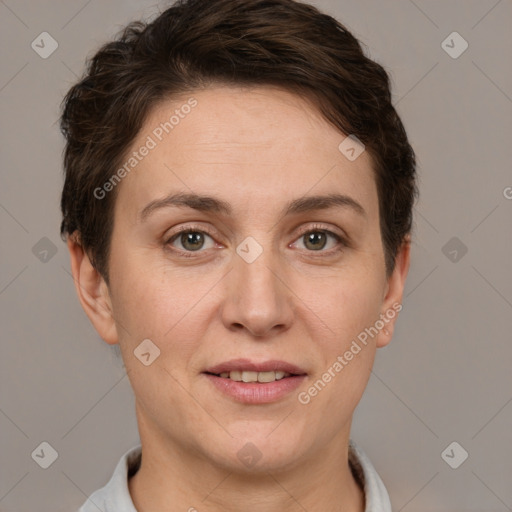 Joyful white adult female with short  brown hair and brown eyes