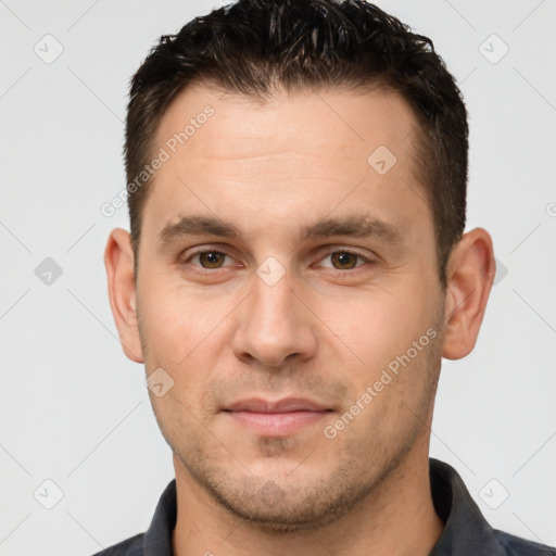 Joyful white young-adult male with short  brown hair and brown eyes