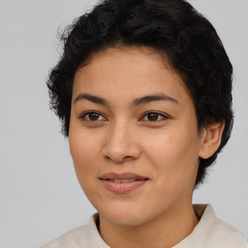 Joyful latino young-adult female with short  brown hair and brown eyes