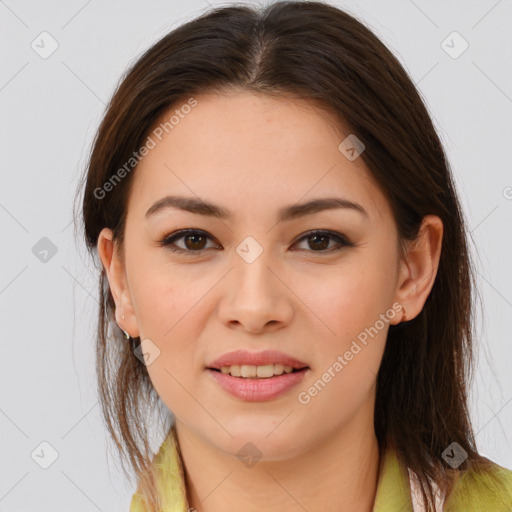 Joyful white young-adult female with long  brown hair and brown eyes