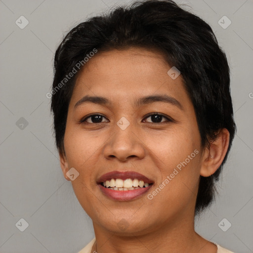 Joyful asian young-adult female with medium  black hair and brown eyes