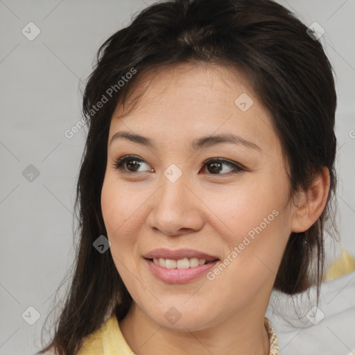 Joyful white young-adult female with medium  brown hair and brown eyes