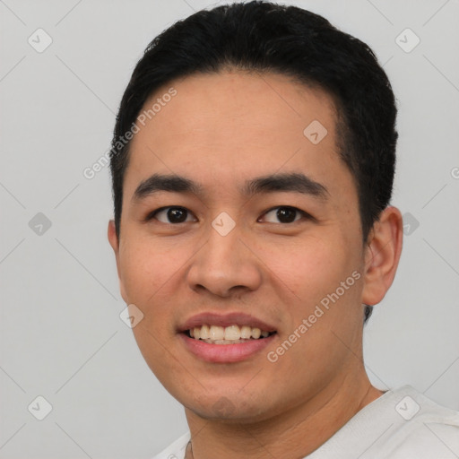 Joyful latino young-adult male with short  black hair and brown eyes