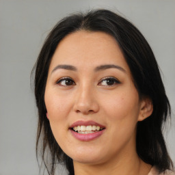 Joyful asian young-adult female with medium  brown hair and brown eyes