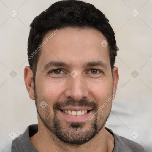 Joyful white young-adult male with short  black hair and brown eyes