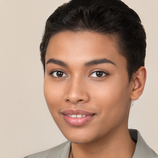 Joyful latino young-adult female with short  brown hair and brown eyes