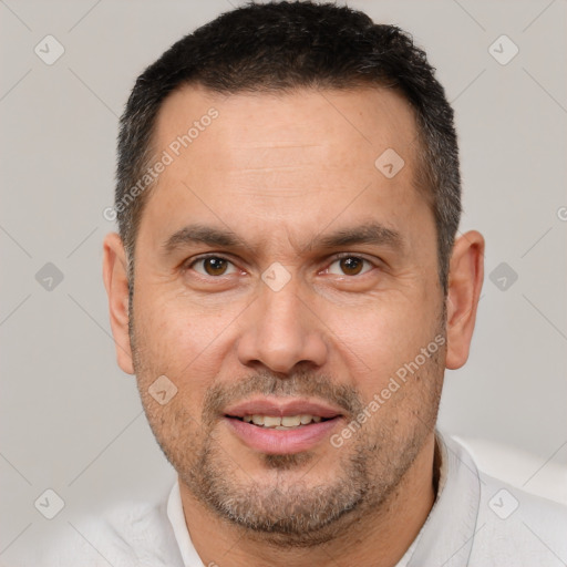 Joyful white adult male with short  brown hair and brown eyes