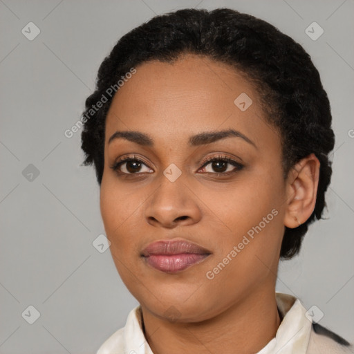 Joyful black young-adult female with short  black hair and brown eyes