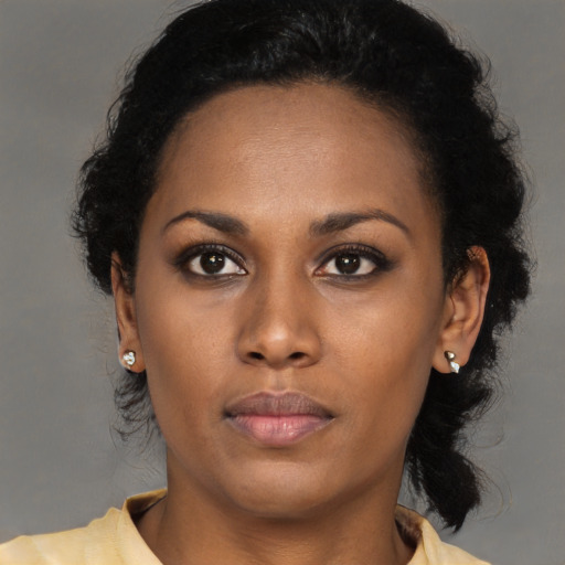 Neutral black young-adult female with long  brown hair and brown eyes