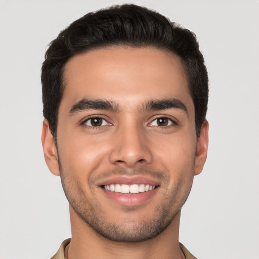 Joyful white young-adult male with short  brown hair and brown eyes