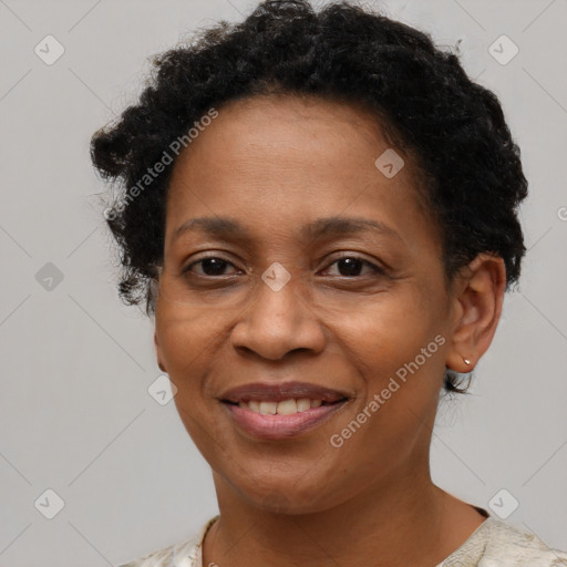 Joyful black adult female with short  brown hair and brown eyes