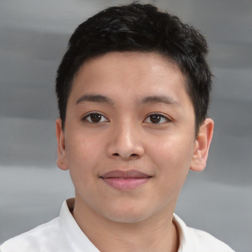 Joyful white child male with short  brown hair and brown eyes
