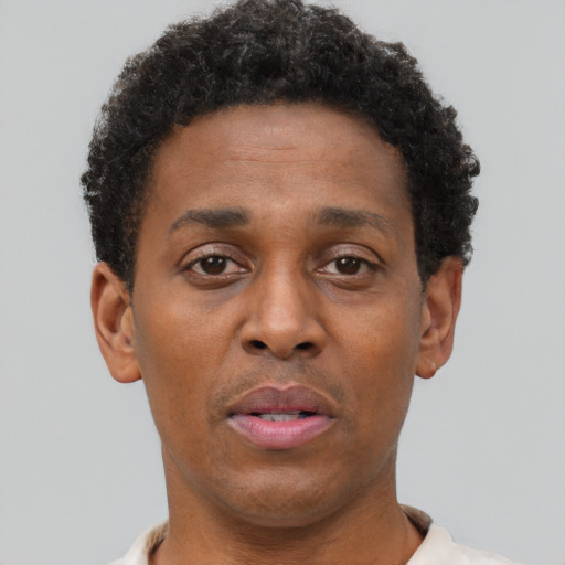Neutral black young-adult male with short  brown hair and brown eyes