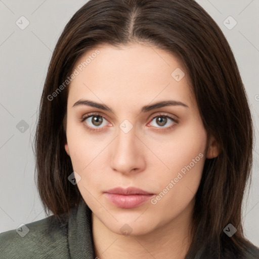 Neutral white young-adult female with long  brown hair and brown eyes