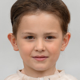 Joyful white child female with short  brown hair and brown eyes