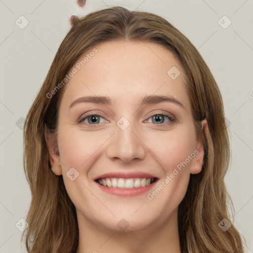 Joyful white young-adult female with long  brown hair and green eyes