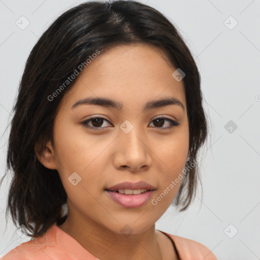 Joyful latino young-adult female with medium  brown hair and brown eyes