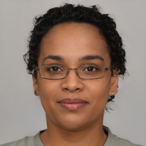 Joyful latino young-adult female with short  black hair and brown eyes