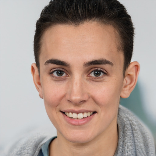 Joyful white young-adult female with short  brown hair and brown eyes