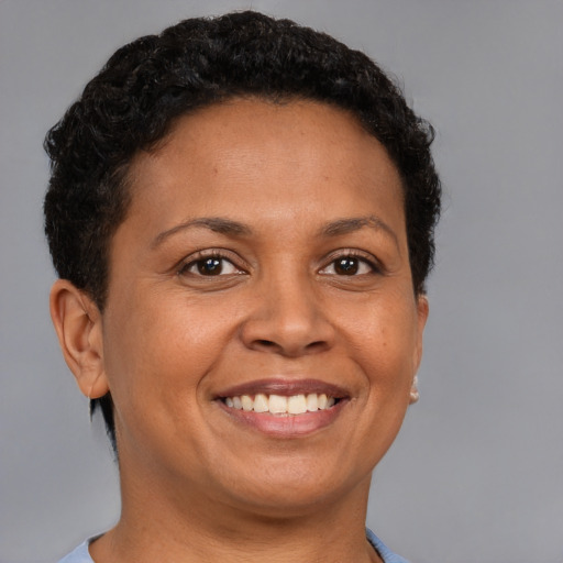 Joyful white adult female with short  brown hair and brown eyes