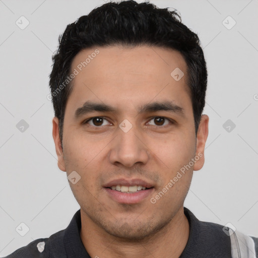 Joyful white young-adult male with short  black hair and brown eyes