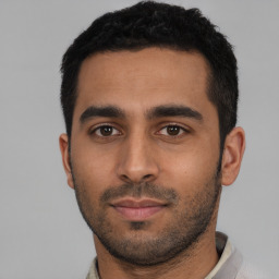 Neutral latino young-adult male with short  black hair and brown eyes