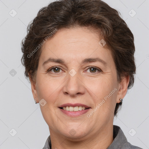 Joyful white adult female with short  brown hair and brown eyes