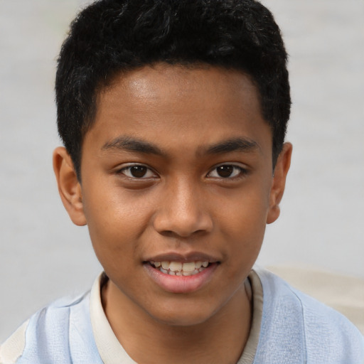 Joyful latino child male with short  brown hair and brown eyes